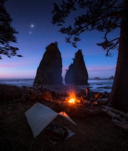 backpacker sitting next to a Mountain Laurel Designs Bivy