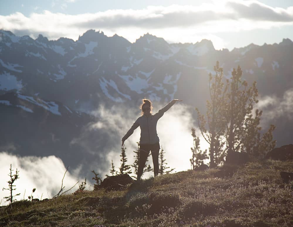 backpacker in front of mountain range