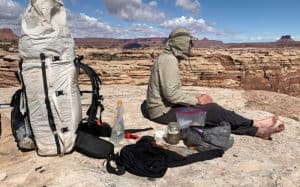 hiker waiting for a cold soaking backpacking meal to hydrate