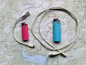 shows a mini iPhone cord and mini Bic lighter next to a full size Bic lighter and full size iPhone cord