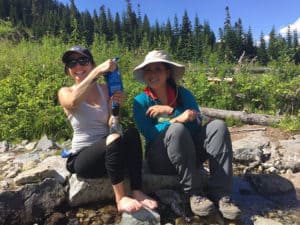 hikers sharing a water filter