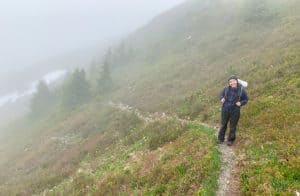 shows hiker wearing rain gear