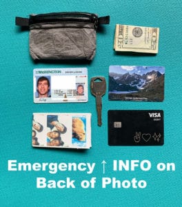 Shows my car key, debit card, 20 dollar bill, I.D., and emergency contact info