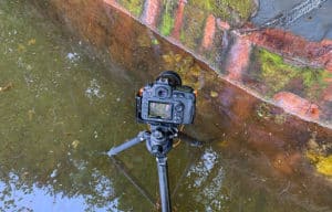 shows tripod in use in a pool of water