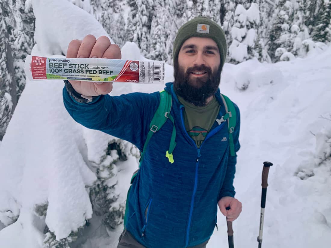 hiker holding a Paleovalley beef stick