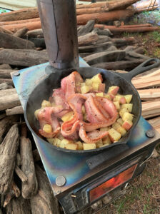 Cooking on my favorite tent stove. 