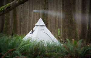 A luxe hot tent in the thick of the forest.