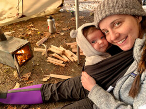 My family sitting next to the luxe tent stove.